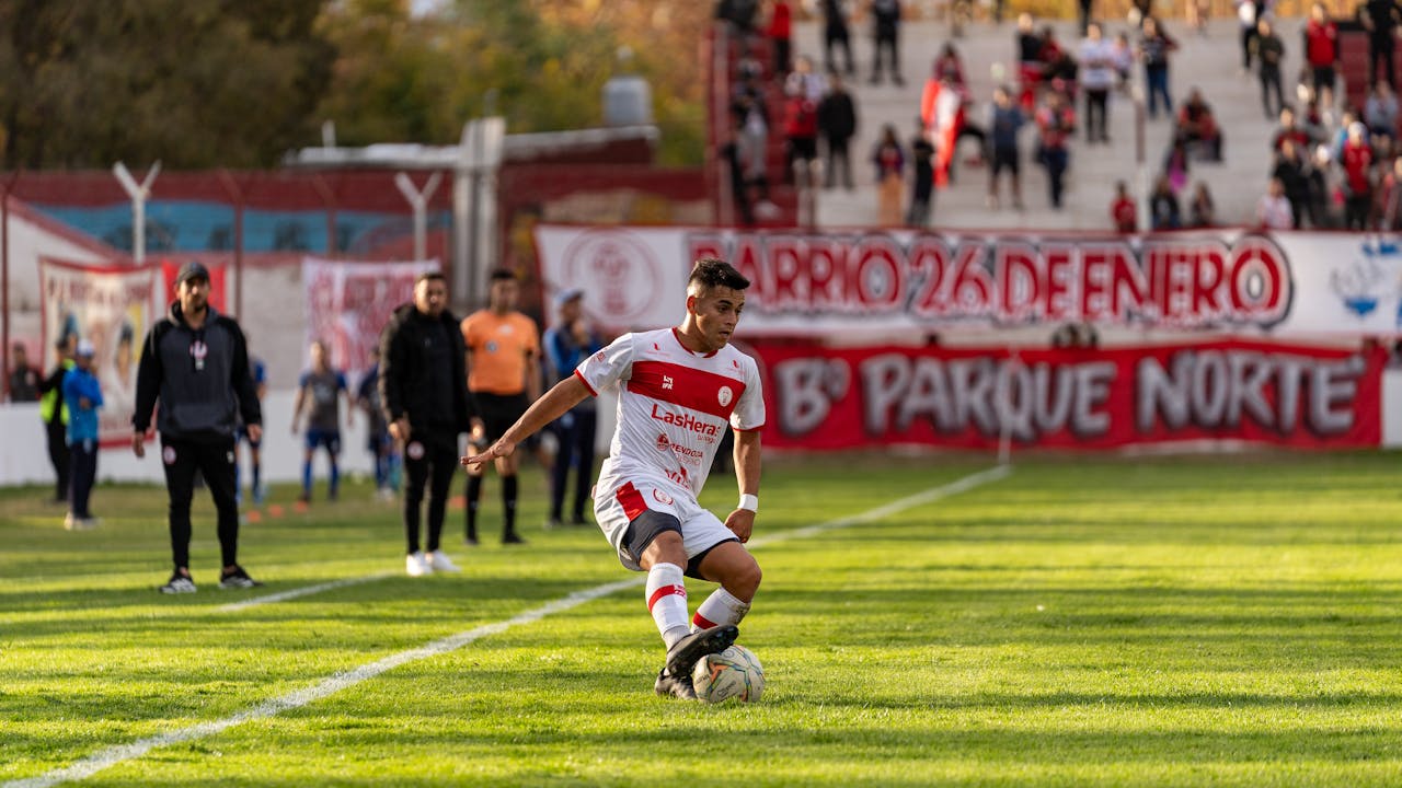 Soccer Player Dribbling The Ball
